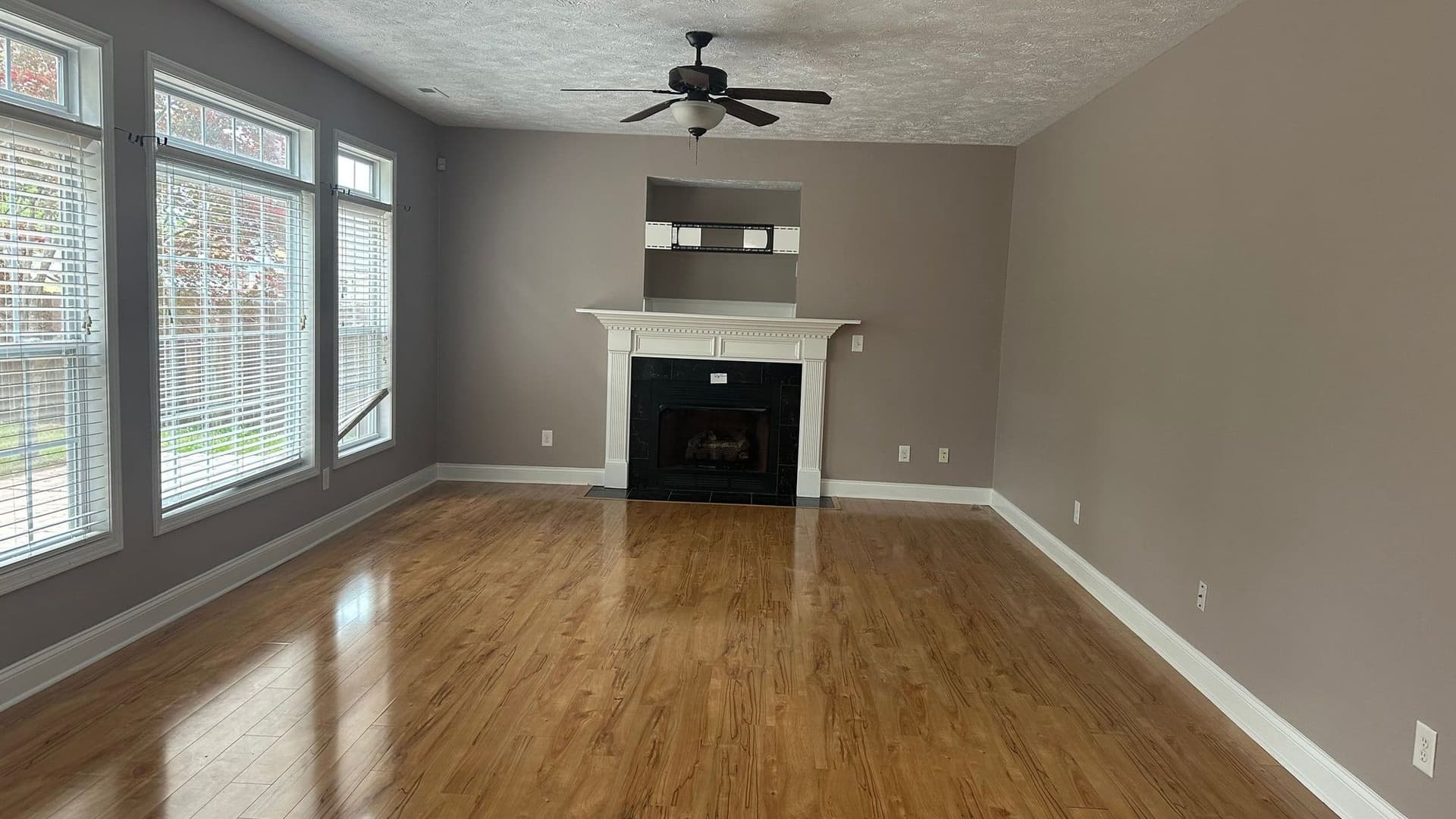 Freshly painted living room with fireplace and trim work in North Carolina
